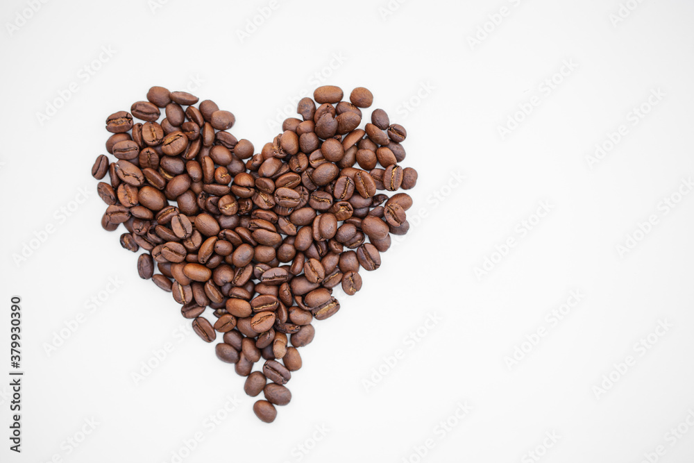 Coffee beans heart isolated on white background. Coffee beans in shape of heart Coffee beans heart isolated on white background. Coffee beans in shape of heart