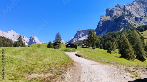 Val Gardena, Italy - 09/15/2020: Scenic alpine place with magical Dolomites mountains in background, amazing clouds and blue sky  in Trentino Alto Adige region, Italy, Europe