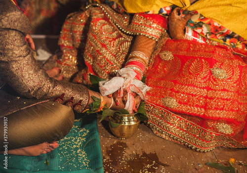 Detail shot of hands at an Indian wedding ceremony photo