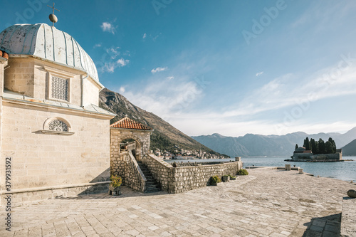 christian building at the bay of kotor with a view to saint georges island, perast, montenegro photo