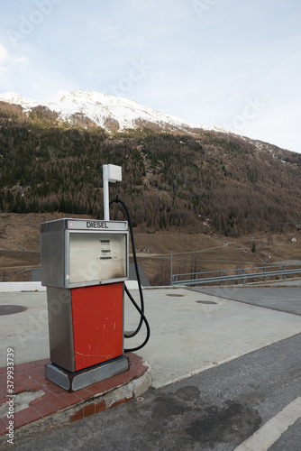 Restored antique gas pump in the alps