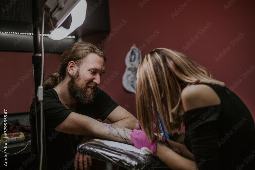 Man in tattoo studio Man in tattoo studio
