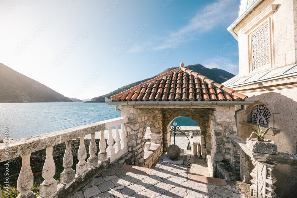 historic mediteranean house at the sea at sunrise, perast, montenegro historic mediteranean house at the sea at sunrise, perast, montenegro