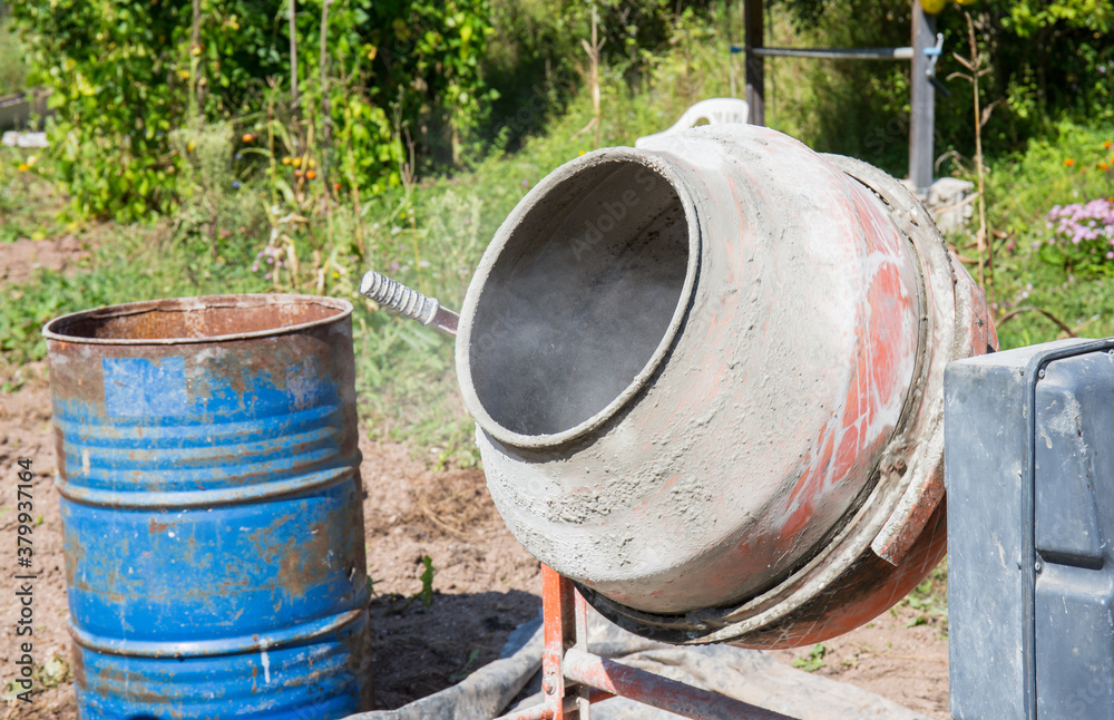 concrete mixer, construction work in progress. Mixer positioned and ready to use concrete mixer, construction work in progress. Mixer positioned and ready to use
