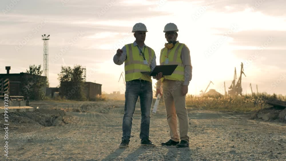 Construction workers are talking at the quarry site Construction workers are talking at the quarry site