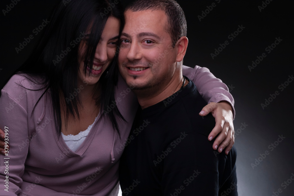 beautiful couple embracing, studio light, neutral background beautiful couple embracing, studio light, neutral background