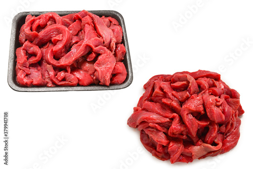 Raw veal slices in container isolated on white background.