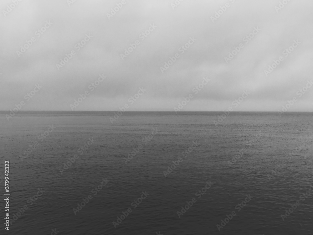 Calm ocean and overcast sky, Puget Sound, WA Calm ocean and overcast sky, Puget Sound, WA