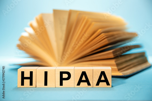 Wooden block form the word HIPAA - The Health Insurance Portability and Accountability Act of 1996.