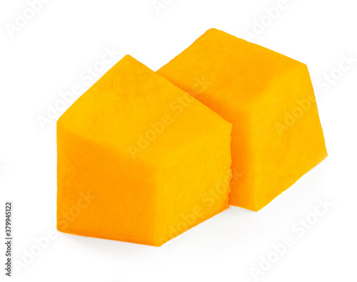 Pumpkin pieces cut in a cube chunks  isolated on white background.