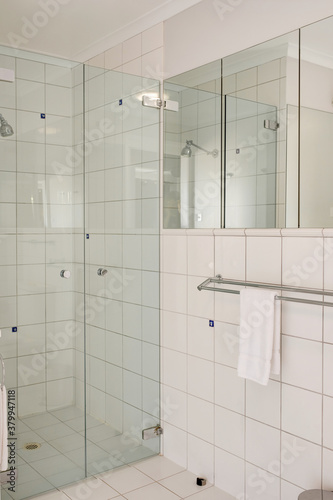 Contemporary white tiled bathroom