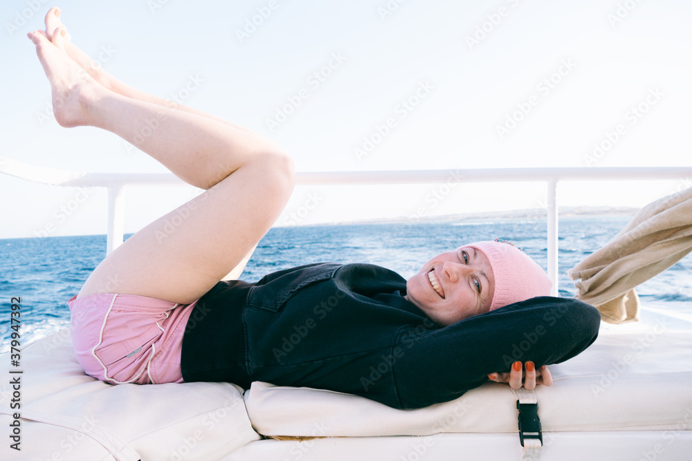 Young woman having fun on ship deck