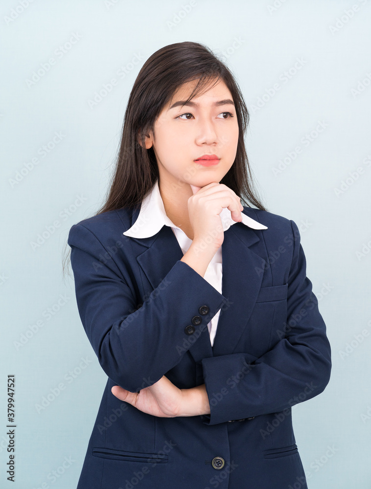 Teenage young girl wearing suit with hand on chin Teenage young girl wearing suit with hand on chin