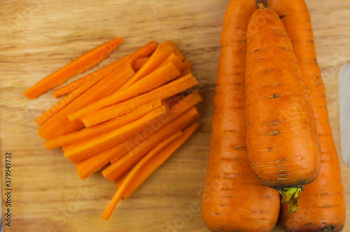 Cutting carrots into strips prepare for cooking.