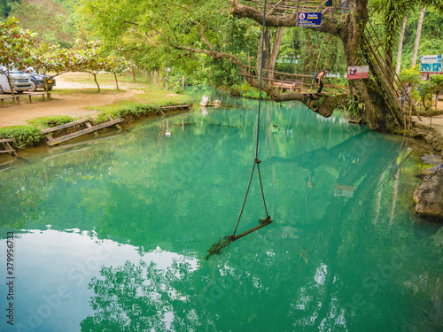 Fototapeta Naklejka Na Ścianę i Meble -  Vangvieng/lao-10 Dec 2017:Tourist with Beautiful nature and clear water of Blue lagoon at pukham cave vangvieng city Lao.Vangvieng City The famous holiday destination town in Lao.