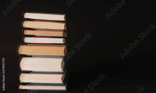 stack of books on black background