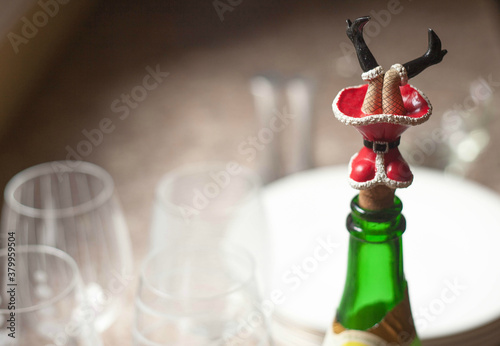 Sexy santa girl wine cork at Christmastime photo