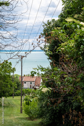 Hungarian landscape with the view of lake Balaton and a local rural street