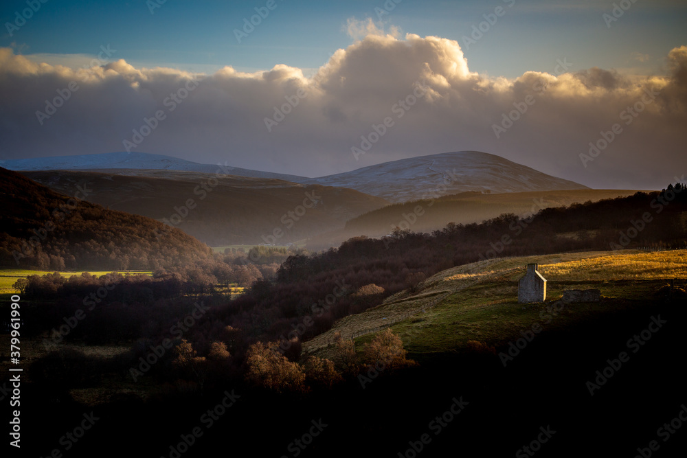 Landscape in winter in the Cairngorms National Park in Scotland at Sunset