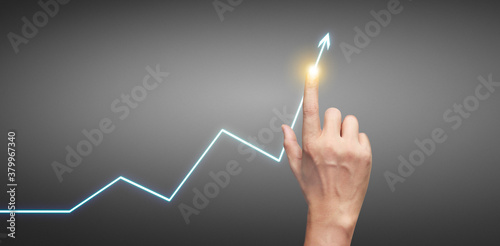 Hand touching graphs of financial indicator accounting market economy analysis chart