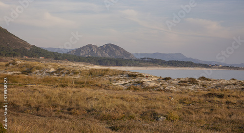 Wide shot of the Area Longa Beach with Louro Peak on the background in Muros, Galicia, Spain