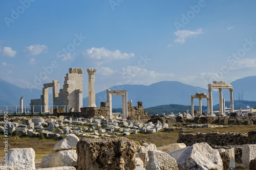 Side view onto antique temple in ancient city Laodicea, Denizli, Turkey. There are remains of doorways, columns & walls. As all city buildings they included in UNESCO World Heritage Tentative List