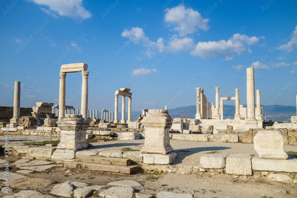 Panorama of Laodicea, ancient city near Denizli, Turkey. There are ruins of antique temple with pillars, colonnaded street & pieces of columns & buildings. City included in Tentative List of UNESCO