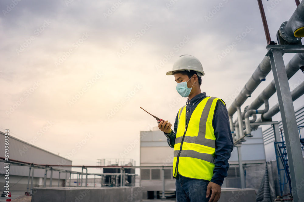 New normal lifestyle of engineer working in site work install chilled water pipe system. New normal lifestyle of engineer working in site work install chilled water pipe system.