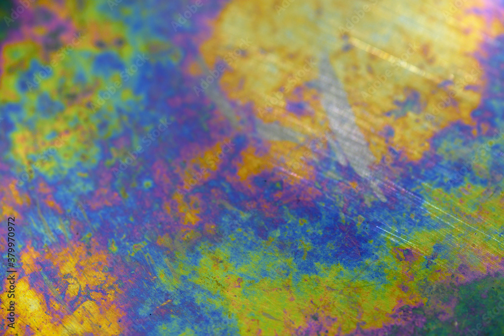Iridescent surface of a metallic plate (background)
