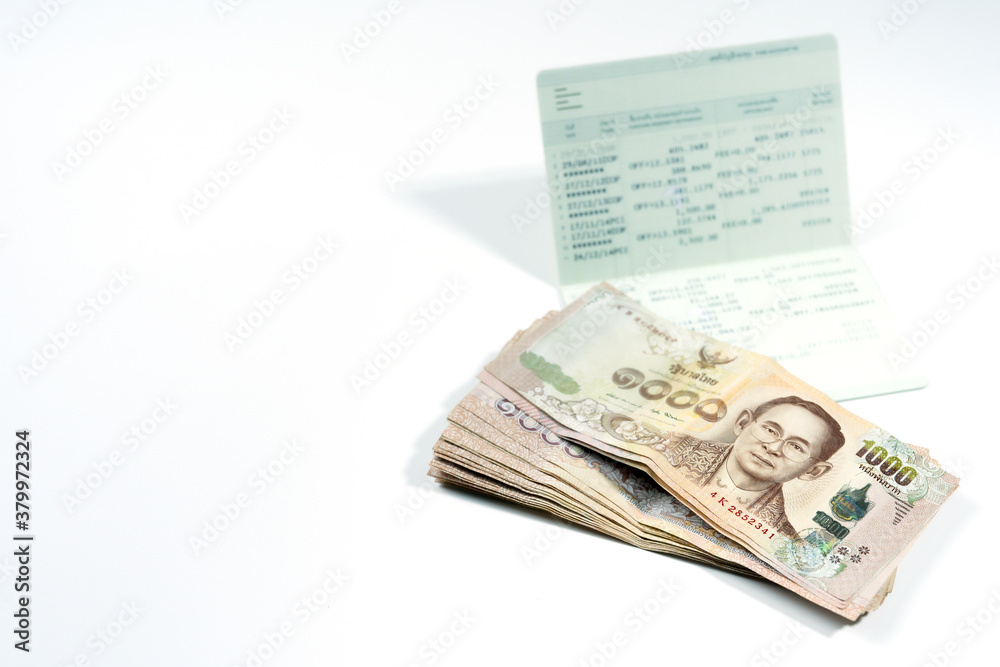 active income saving and invest with money and passbook on white isolated background active income saving and invest with money and passbook on white isolated background