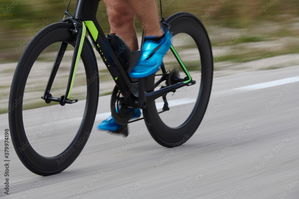Fototapeta premium closeup of triathlon athlete riding bike