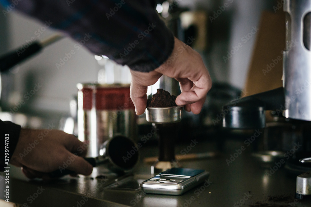 Barista measuring coffee Barista measuring coffee