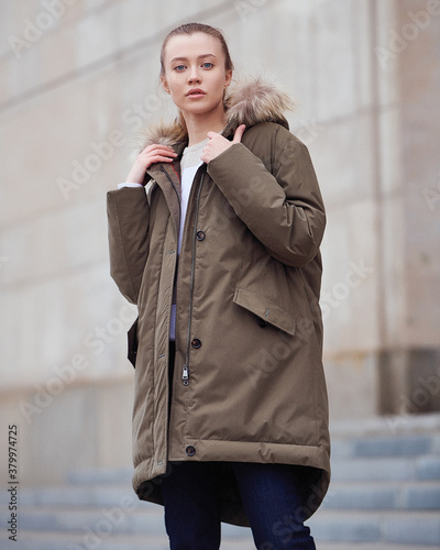 Young beautiful blonde model in fashionable clothes on the street. Street modern womens fashion