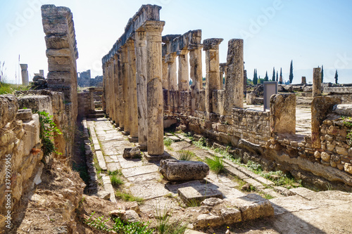 Panorama of antique latrine in ancient city Hierapolis, Pamukkale, Turkey. There are columns & remains of seats. Building was part of urban sanitation system. All city objects included in UNESCO List