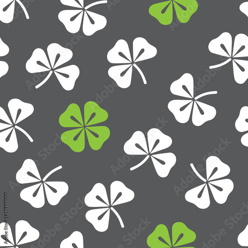 Seamless pattern with clovers. Vector hand drawn illustration. Illustration for wrapping paper, post cards, prints for clothes, and emblems.  © Nataliya