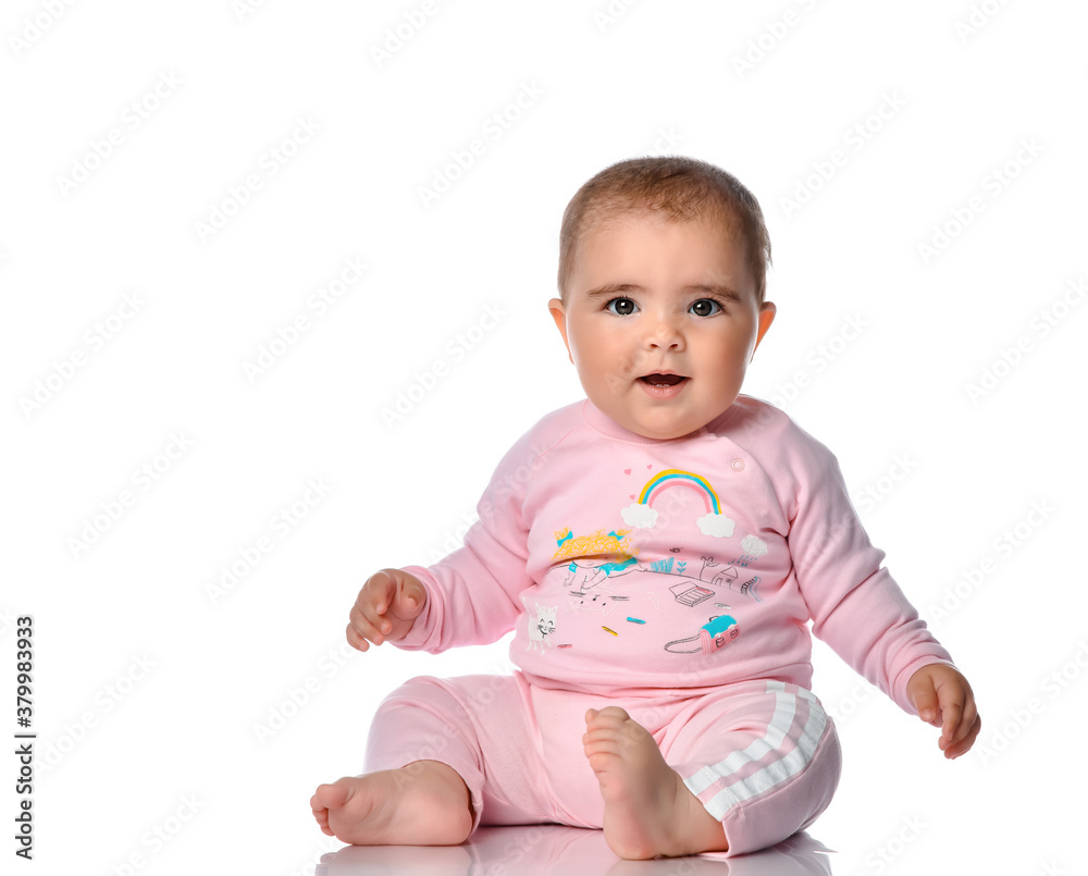 Cute little girl laughs looking at the camera on a white background. Cute little girl laughs looking at the camera on a white background.