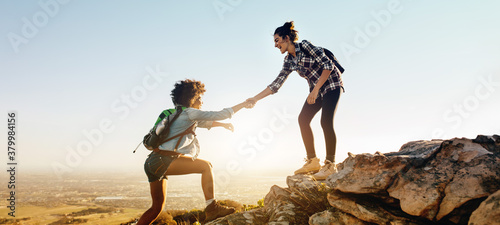 Helping each other to the top of mountain photo