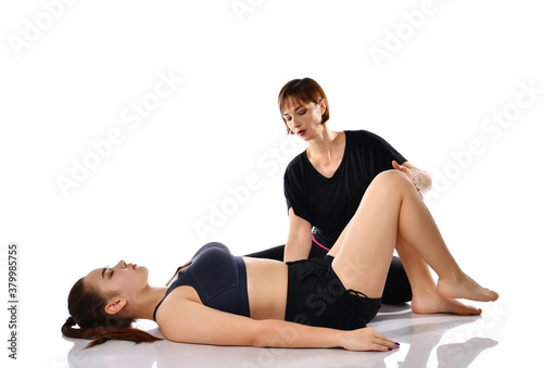 Girl training with trainer doing breathing exercise