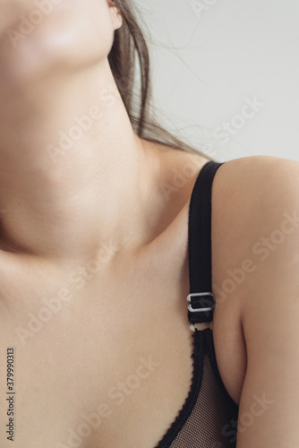 Details on woman body with black bra photo