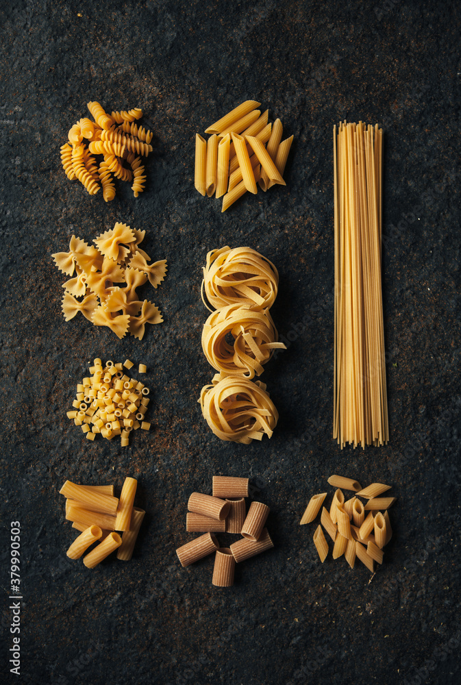 Different kind of pasta on dark background Different kind of pasta on dark background