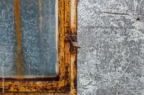 Old metal window with lock