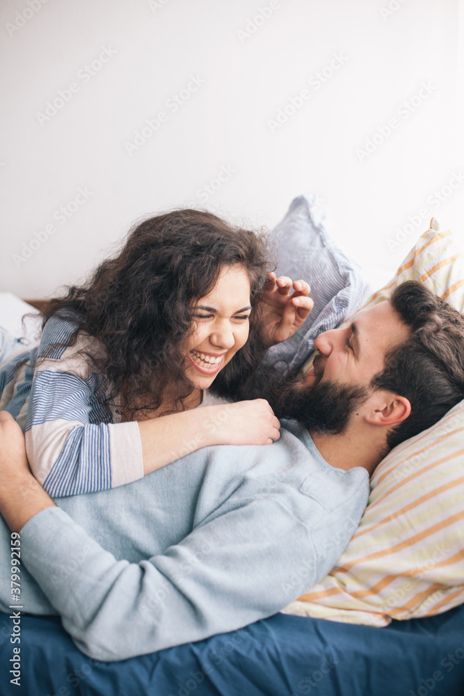 Couple spending time together in a bed Couple spending time together in a bed