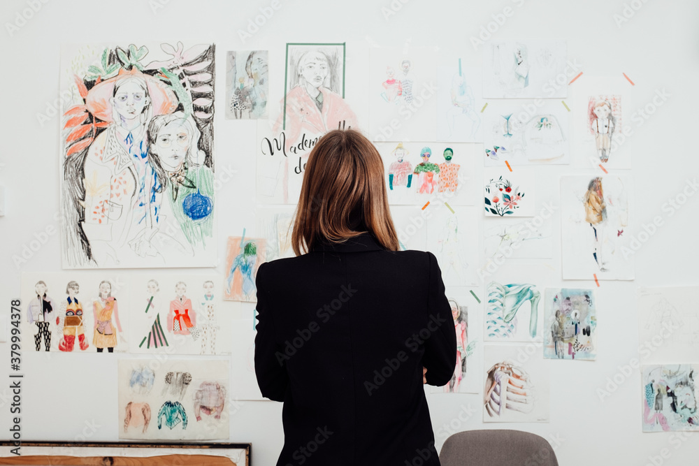 Designer Looking at Her Work