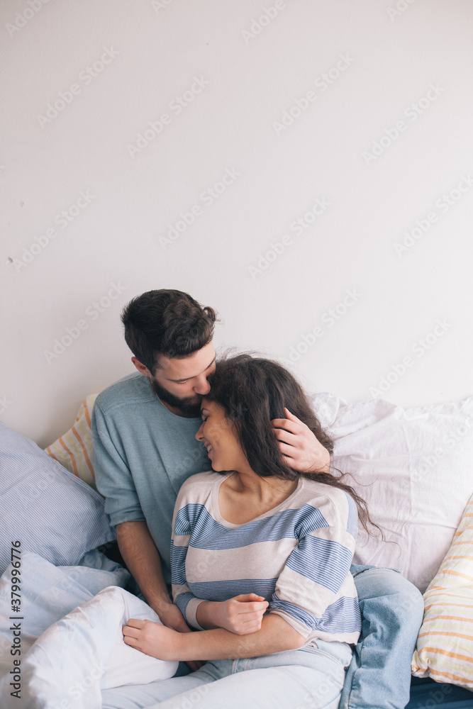 Couple spending time together in a bed Couple spending time together in a bed
