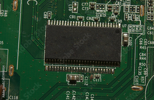 microchip on green electronic pcb closeup