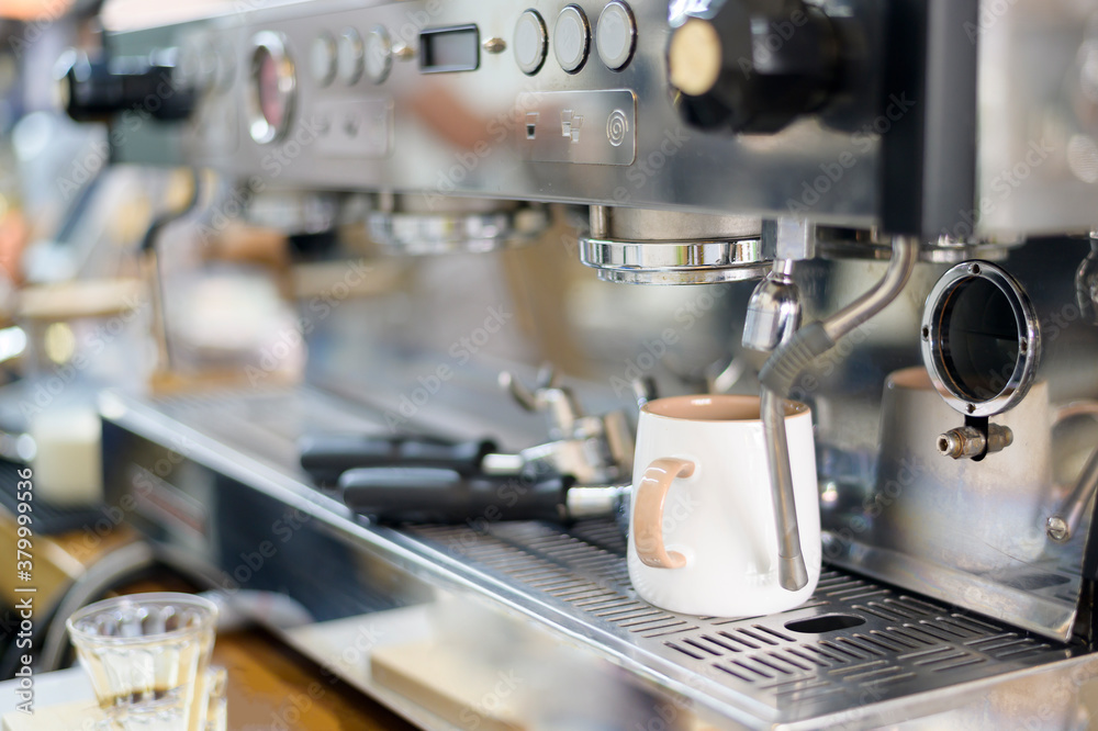 coffee machine making black coffee and pouring into a cup at cafe coffee machine making black coffee and pouring into a cup at cafe