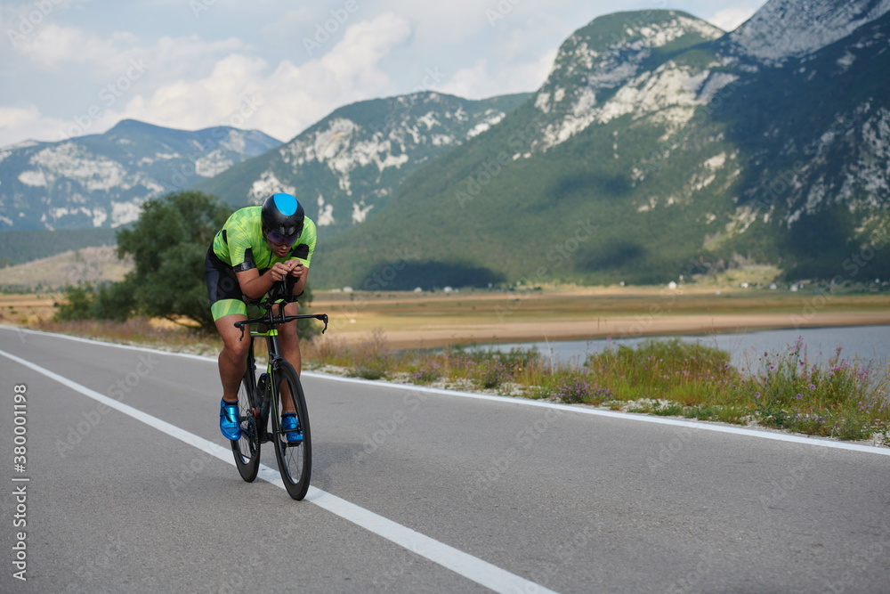 Fototapeta premium triathlon athlete riding bike