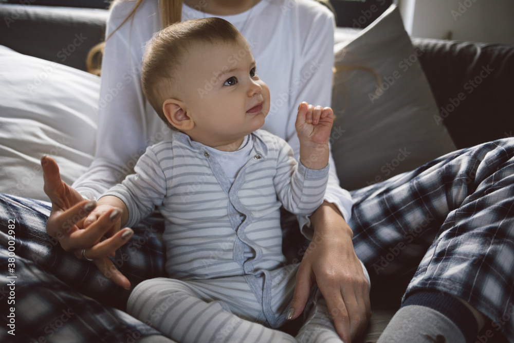 Baby Boy Sitting on Bed With His Mother Baby Boy Sitting on Bed With His Mother