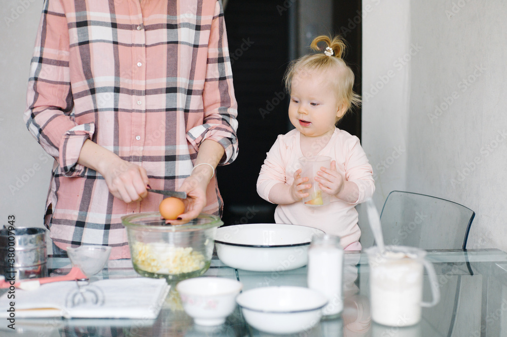 Mother and daughter making a dough