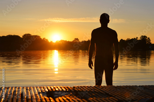 Man at sunset at the lake